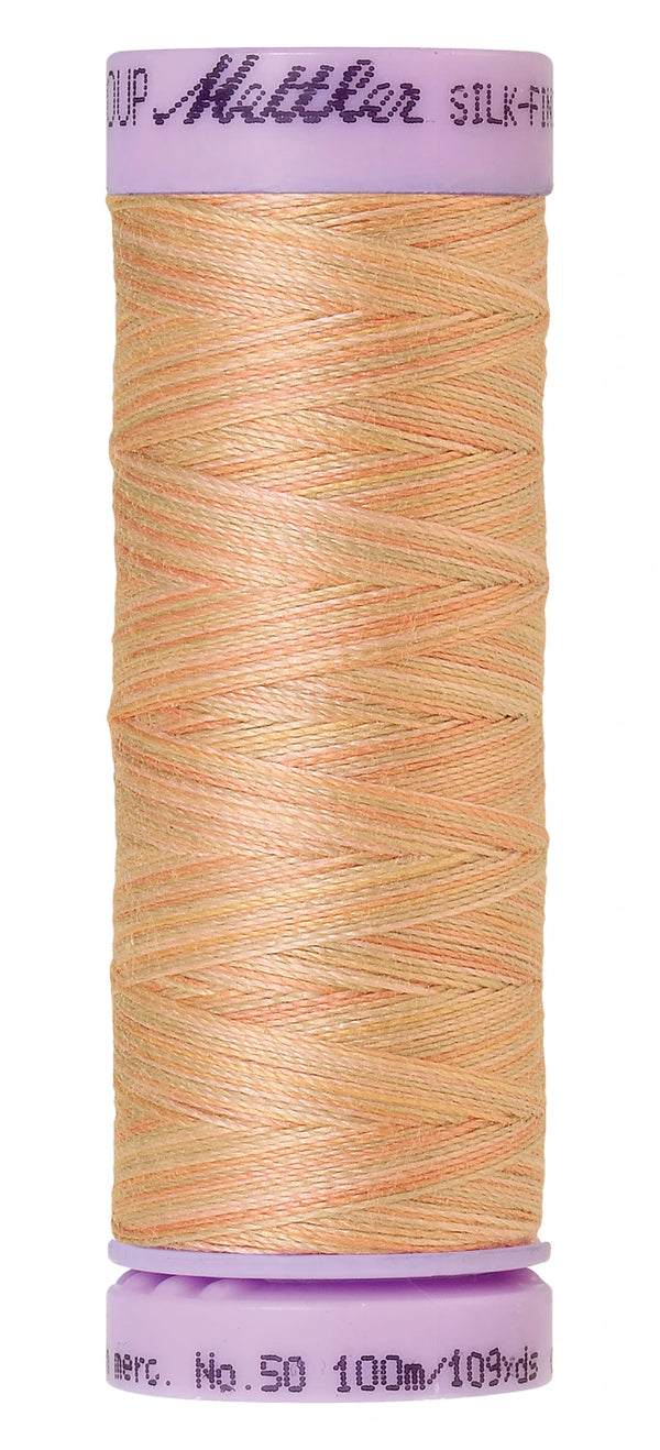 Mettler 9857 Silk-Finish 50wt Variegated Cotton Thread 109yd/100M Coral Sands