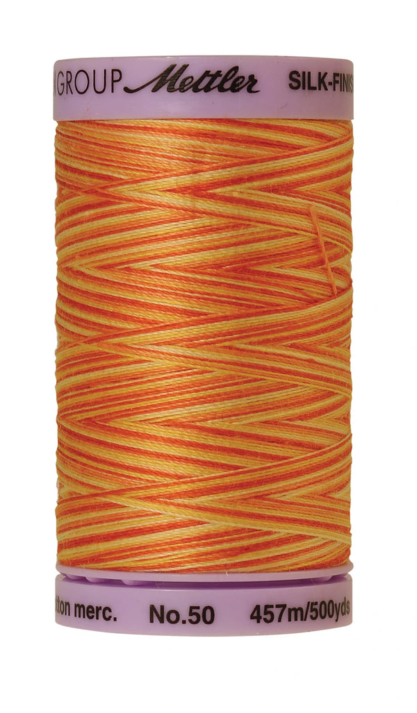 Mettler 9831 Silk-Finish 50wt Variegated Cotton Thread 500yd/457M Orange Ana